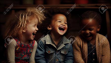 Portrait of a group of children laughing in a dark room.